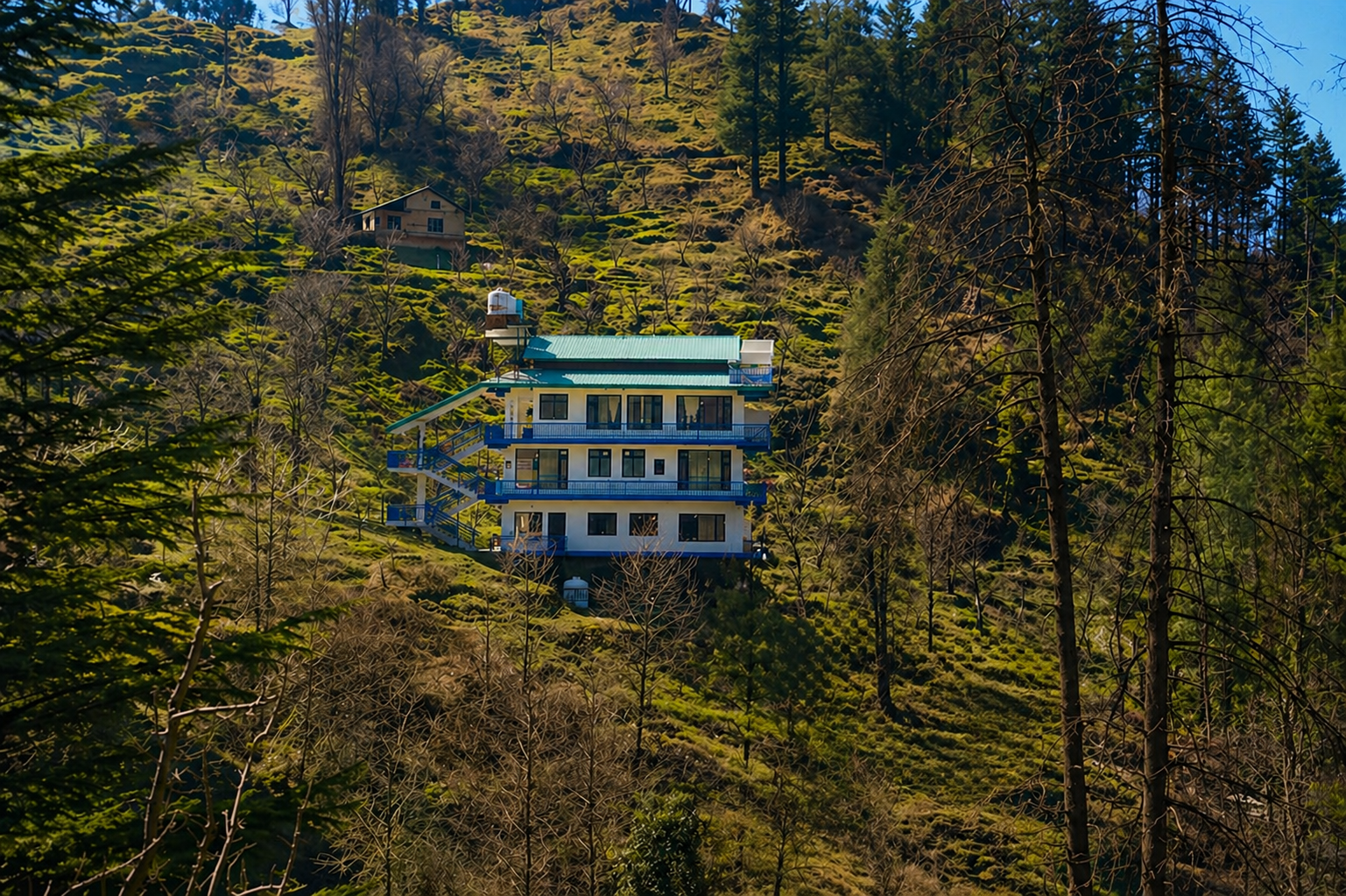 Cottage exterior — blue balconies
