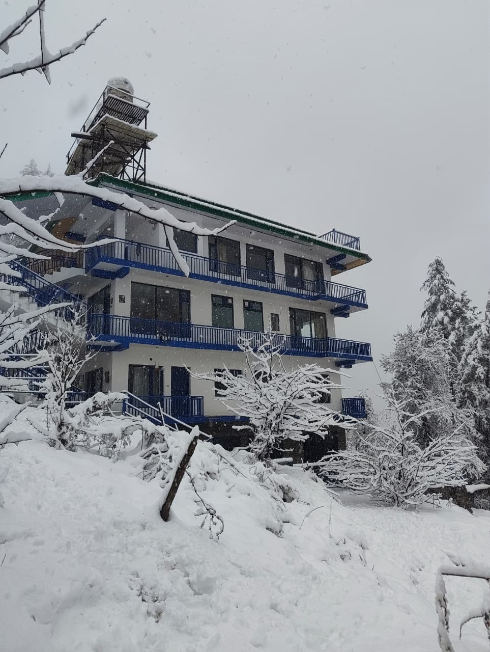 Cottage exterior — blue balconies