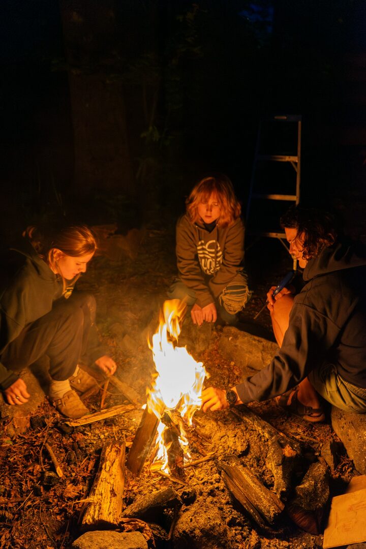 Guests gathered around a campfire