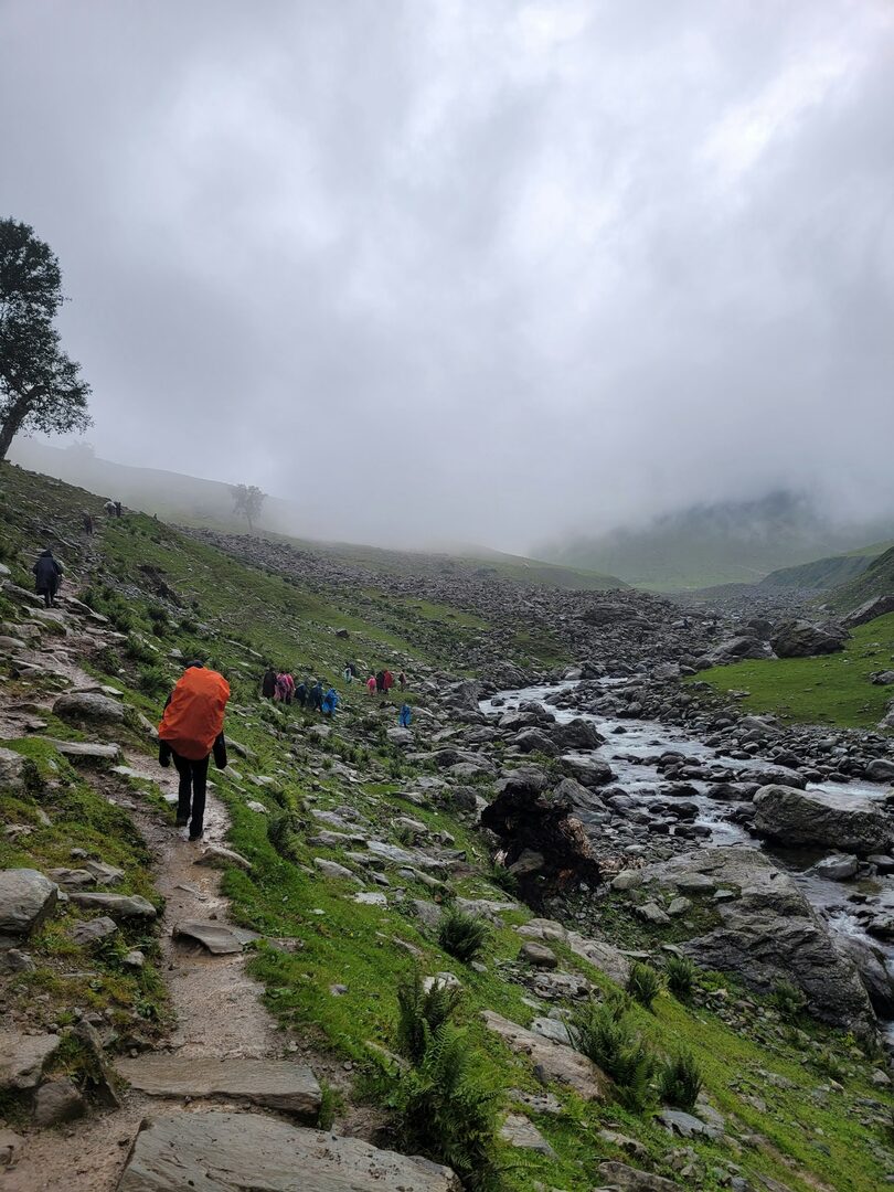 Hikers on a misty Himachal trail