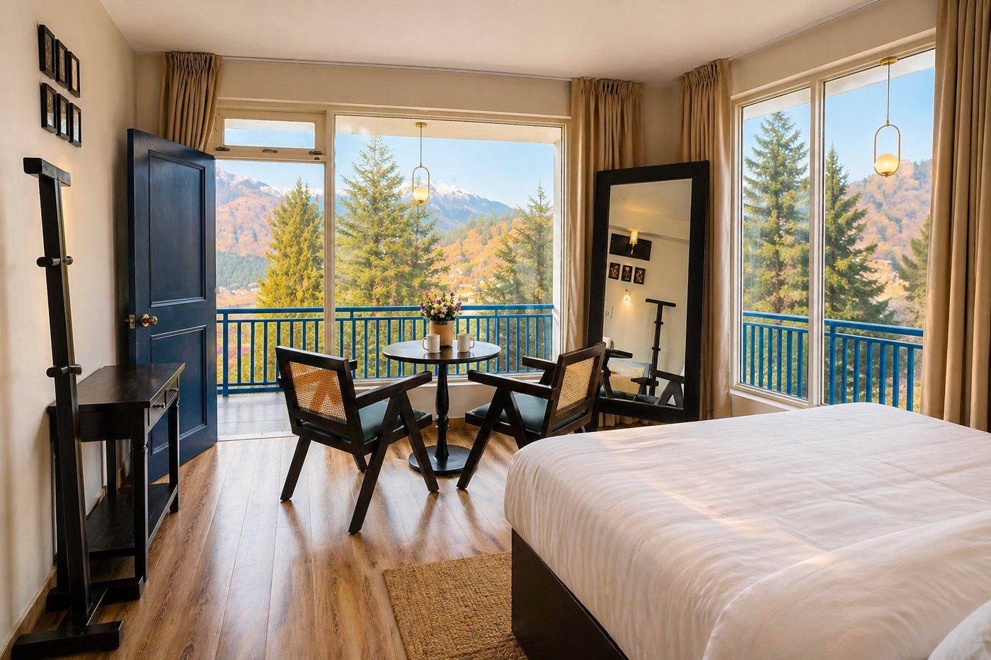 A guest room opening onto a balcony with mountain views at Curious Cat Cottage